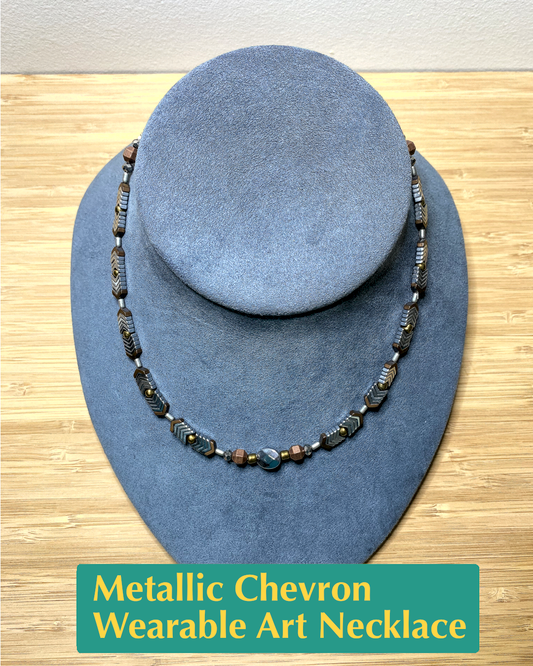 Handmade, wearable art necklace in silver, bronze, and gold